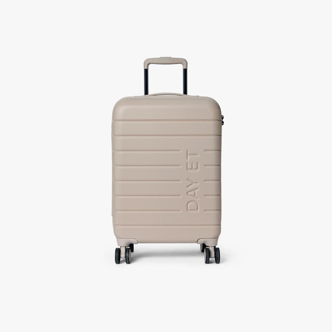 Beige suitcase with 'DAV ET' branding on a white background